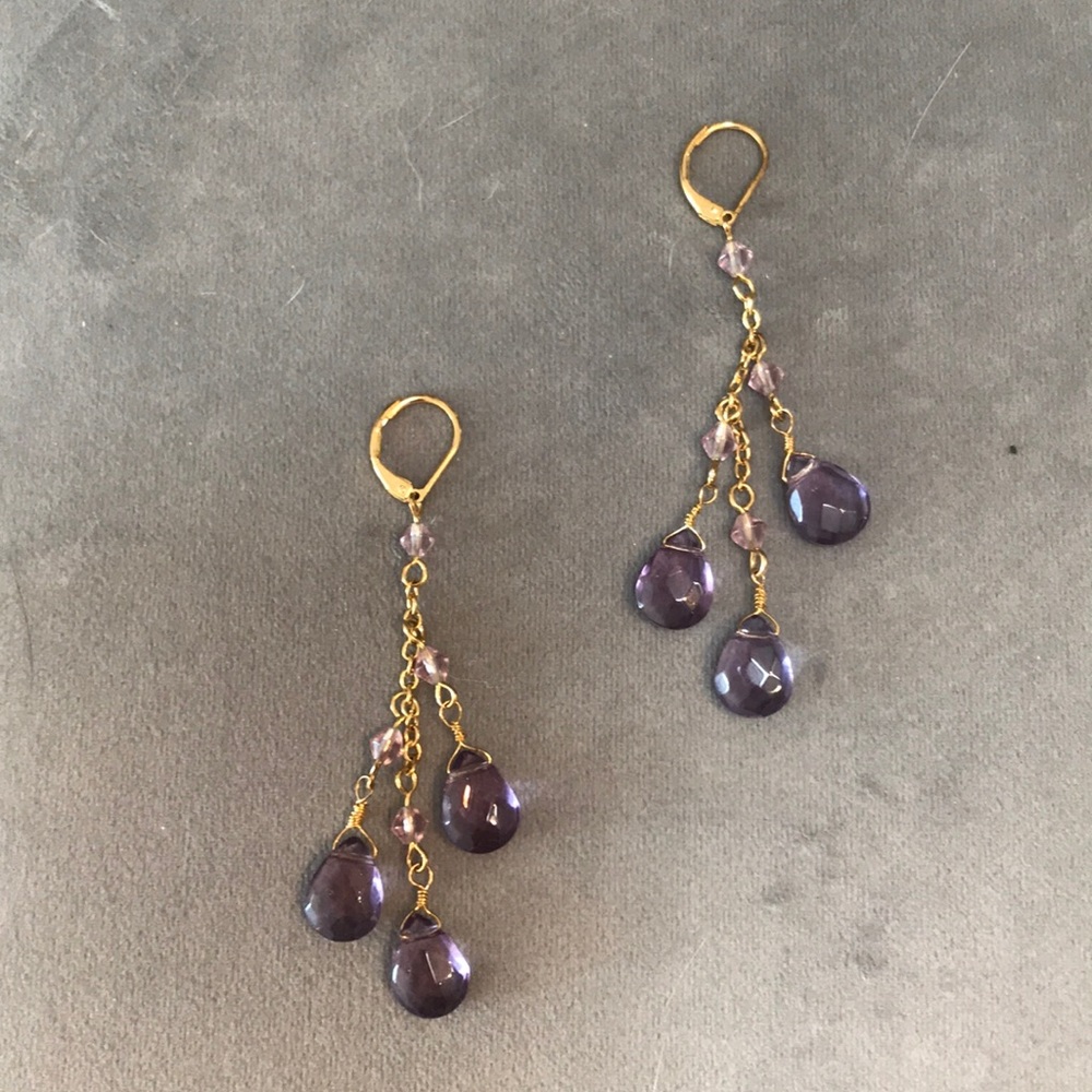 Beautiful gold and purple dangling earrings.